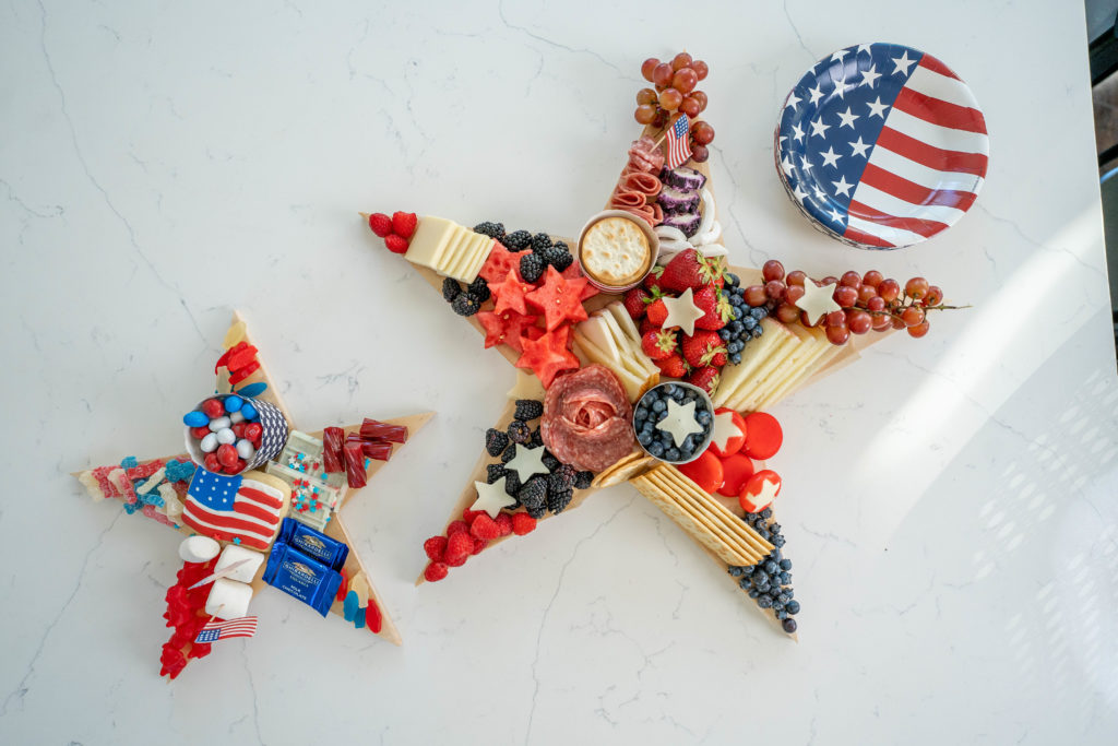 sweet and savory star shaped patriotic charcuterie and dessert board for 4th of july grazing boards