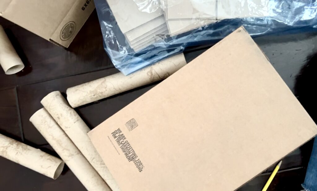 Various sizes of cardboard boxes and paper towel rolls to be used in a craft