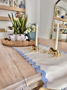 Table setting with DIY white and blue scalloped table runner.