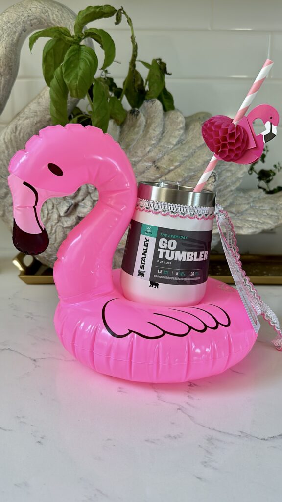 Mini flamingo drink pool floatie end of year teacher gift idea that has stanley wine tumbler in it